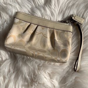 Ivory coach wristlet
